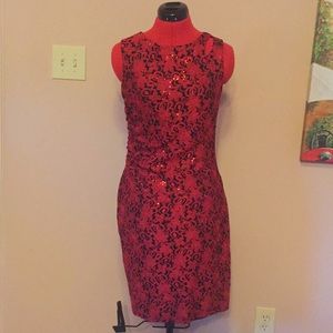 Red dress with ruching on the side.